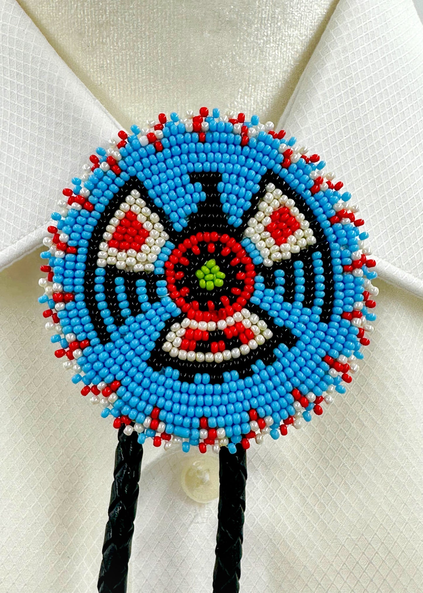 Handmade beaded Cyan Blue Thunderbird leather Bolo Tie